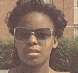 Woman of colour wearing sunglasses outdoors